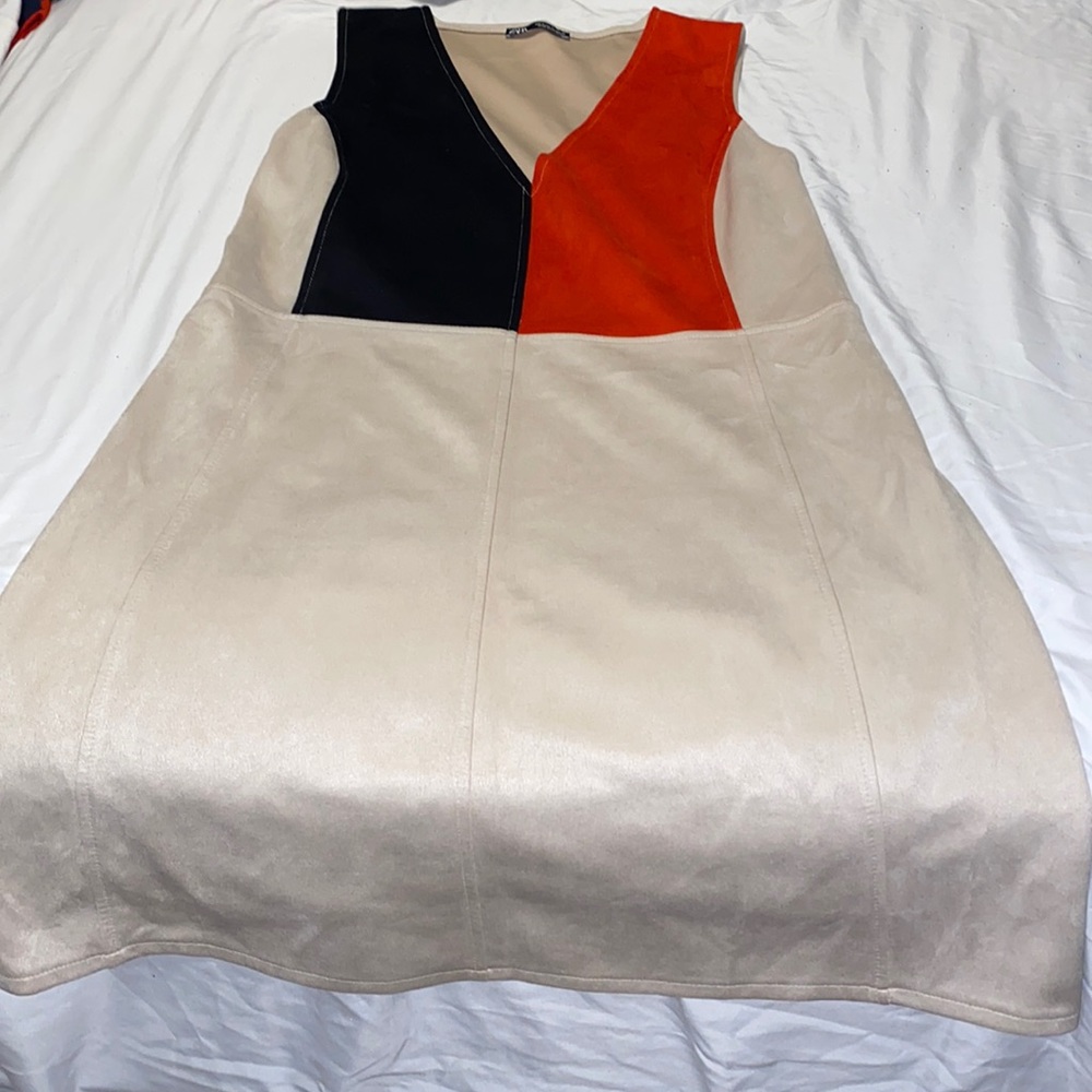 tan v-neck dress with red/black color-block